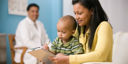 Mother and baby with healthcare professional