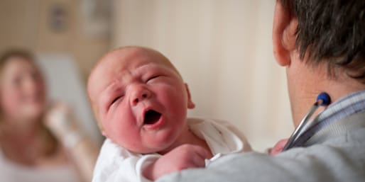 Mother and baby with healthcare professional