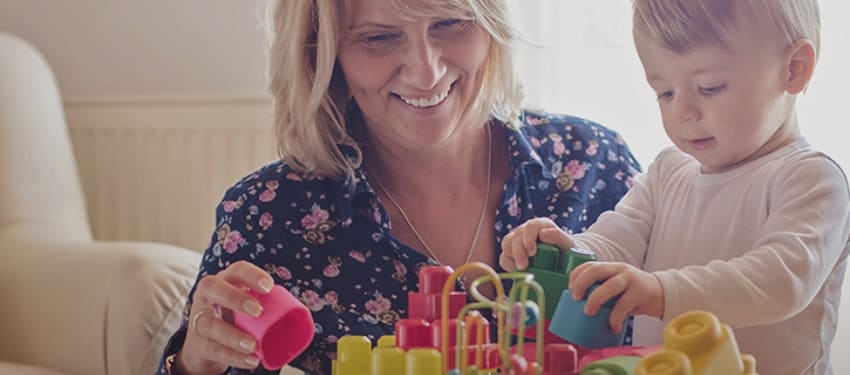 Mother and child building with blocks