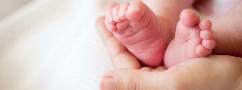 mum-holding-baby-foot