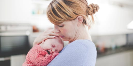 Mother comforting crying baby