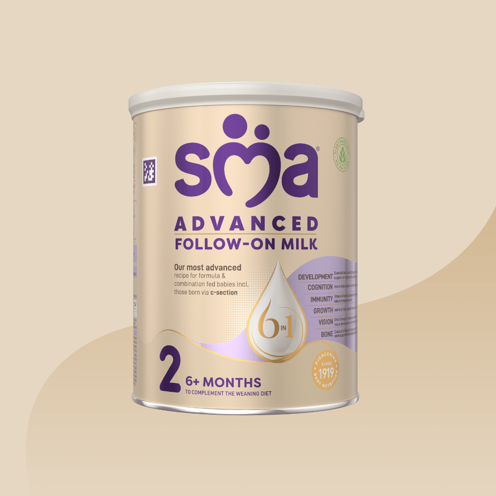 Gold tin of SMA Advanced Follow-on Milk for babies 6-12 months with a grey lid on a gold background